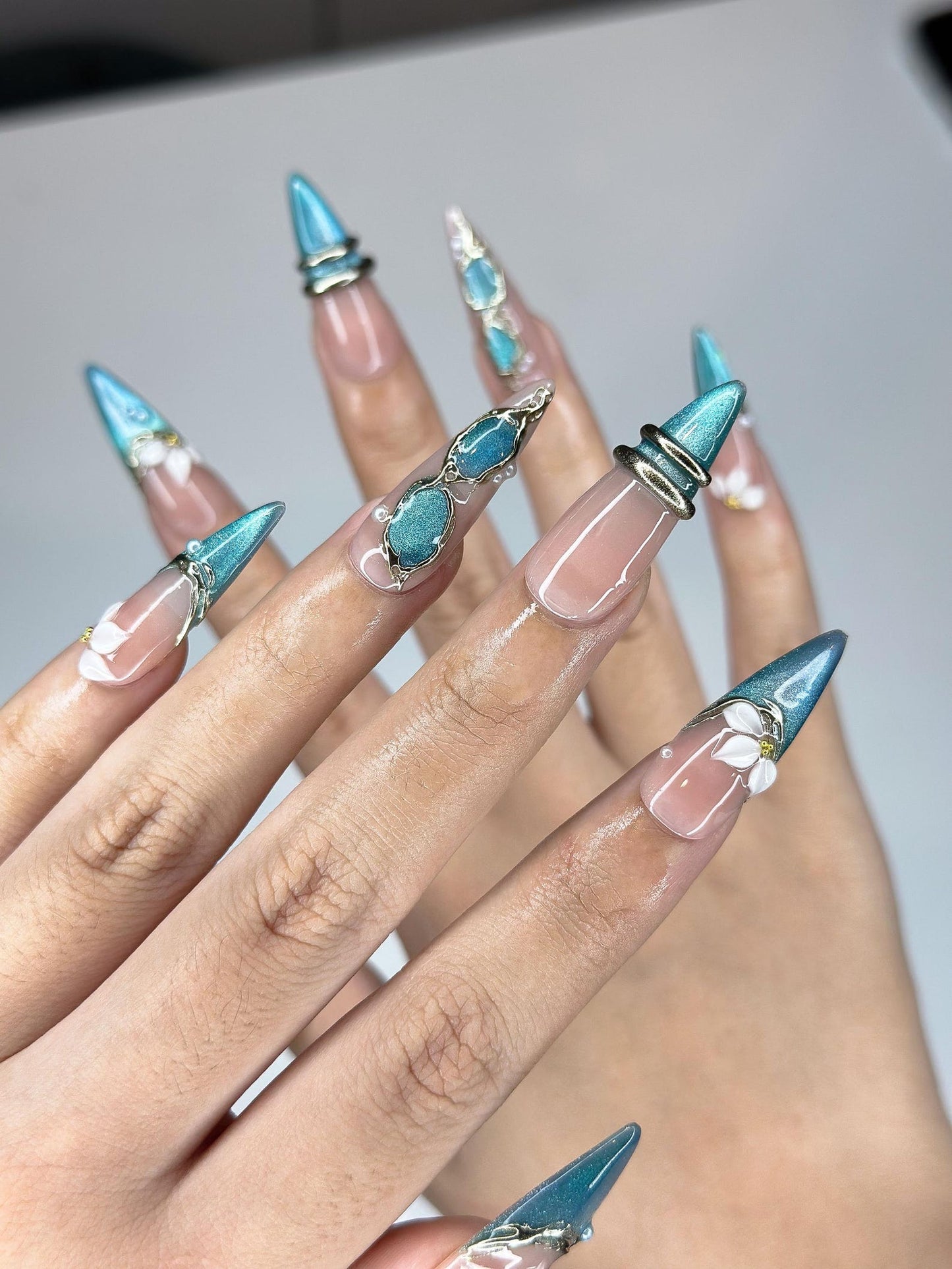 Teal Cat-Eye & 3D White Bloom Nails | Antique Gold Chrome Accents | Luxury Botanical Magnetic Stiletto Art | Elegant Nails | JB379IK