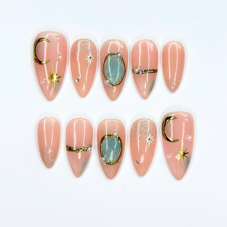 Celestial Press On Nails with Gemstone Charm | Nude Crystal Fake Nails in Almond Shape | Handmade Star Nail Art for Women | OB515UA