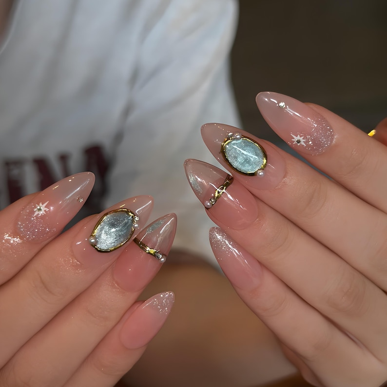 Celestial Press On Nails with Gemstone Charm | Nude Crystal Fake Nails in Almond Shape | Handmade Star Nail Art for Women | OB515UA